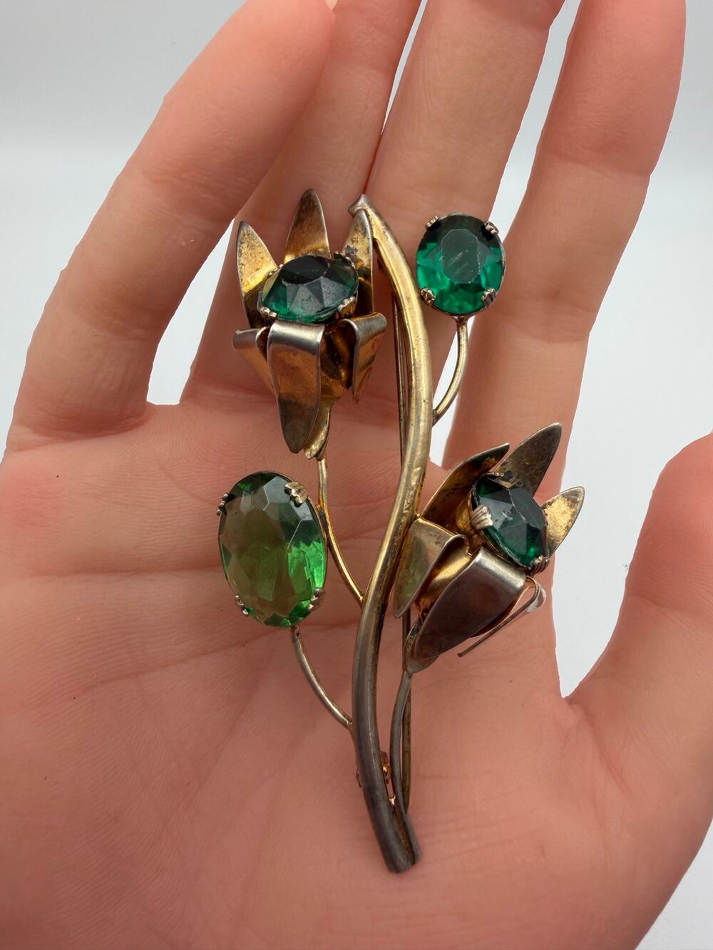 sterling brooch with emerald green stones gold washed sterling